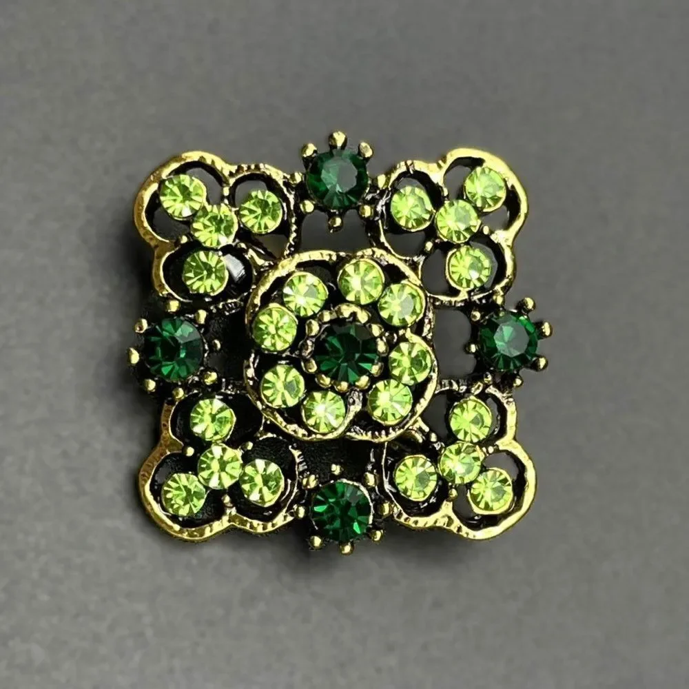 Yellow Gold with Emerald and Peridot Green Crystal Ornate Pin Back Brooch